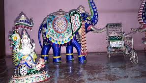Close-up of Gulabi Meenakari pink enamel metal craft showcasing intricate traditional floral patterns
